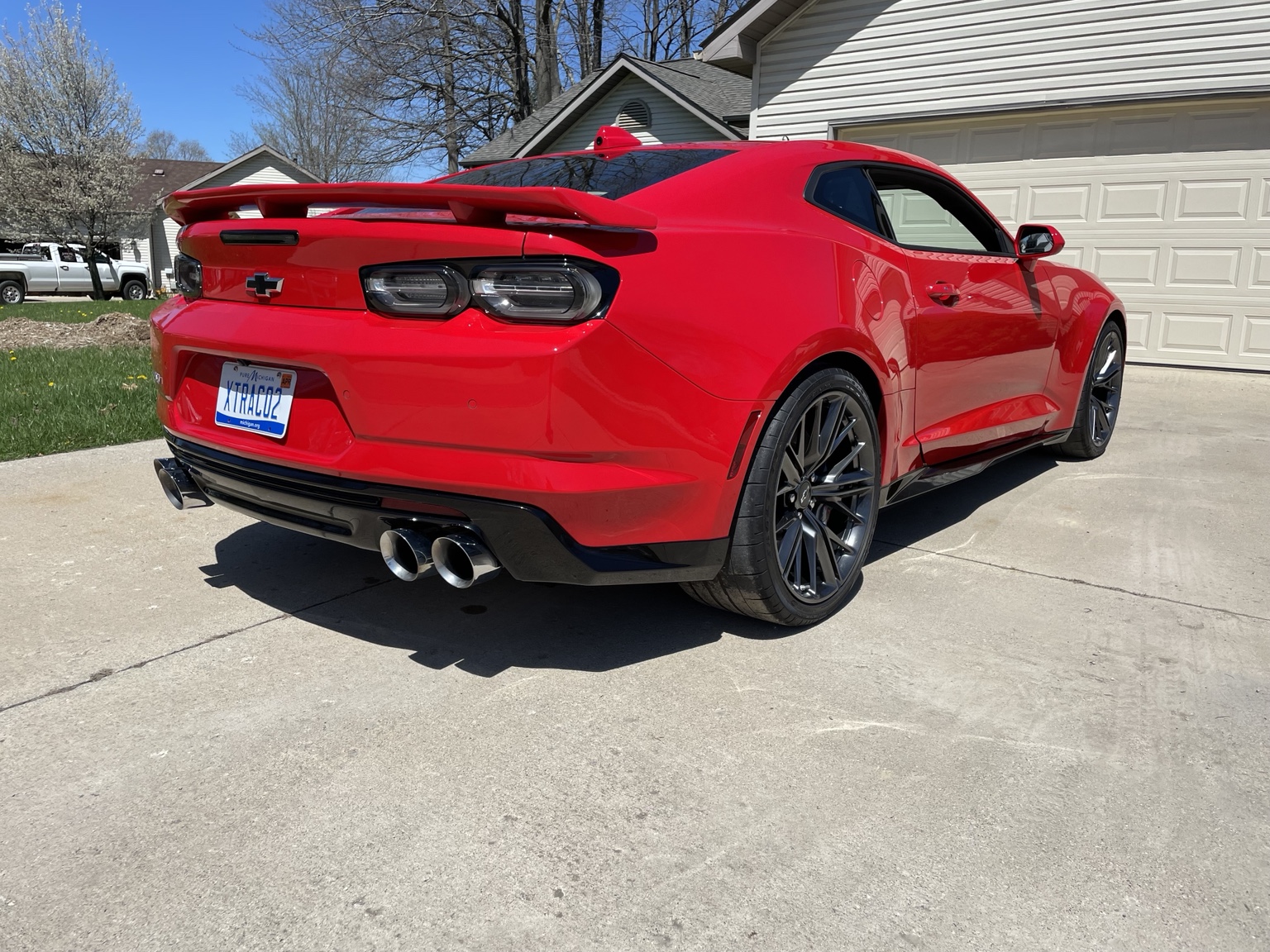 Rear view of red Chevrolet Camaro ZL1 after exterior detailing